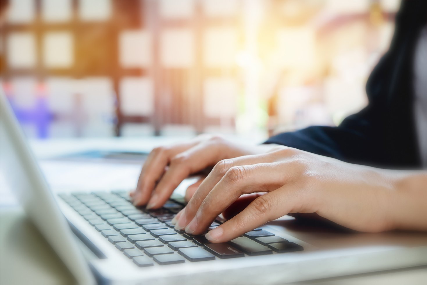 Closeup Photo of Female Hands Typing Text on Keyboard. 